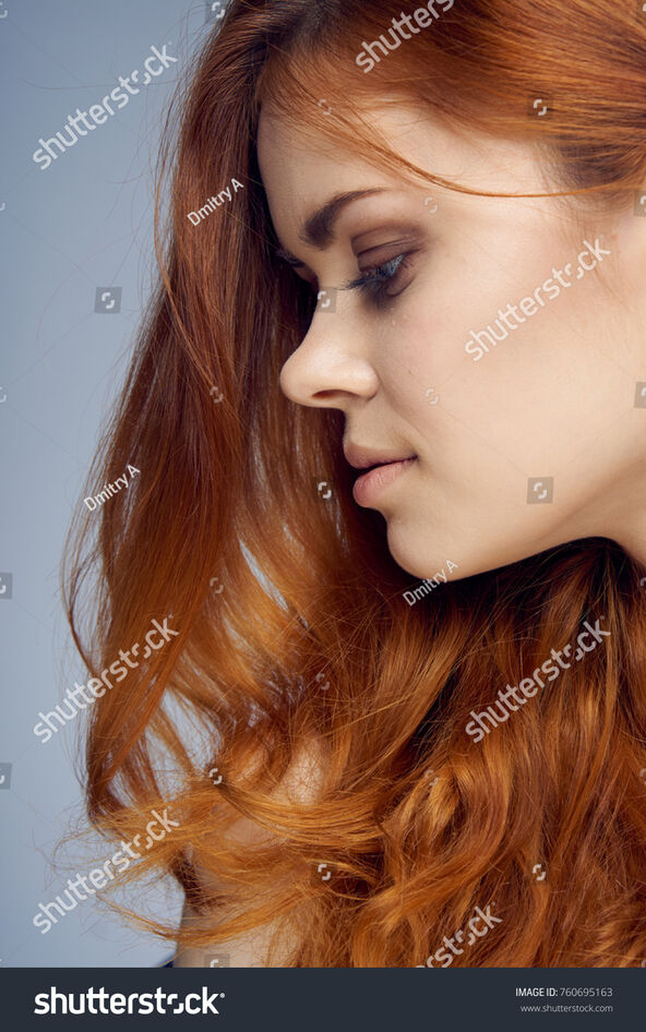 stock-photo-beautiful-young-woman-on-a-gray-background-portrait-760695163.jpg