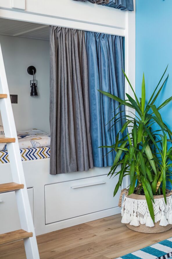 stock-photo-blue-curtains-for-bunk-bed-for-boys-in-the-bedroom-without-people-2450383023.jpg