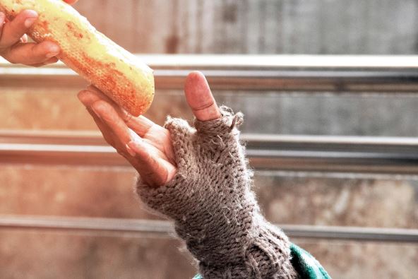 stockphotohandhomelessmanandbread1077221084.jpg