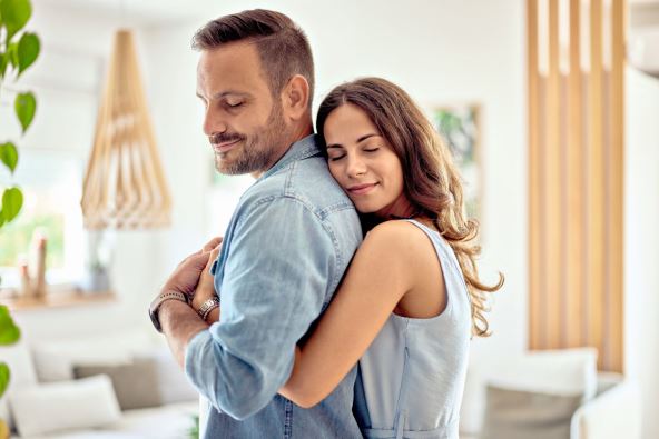 DODIRI SU JAKO VAZNI  stock-photo-a-couple-in-love-enjoying-a-hug-in-the-morning-at-home-feeling-peaceful-2357743263.jpg
